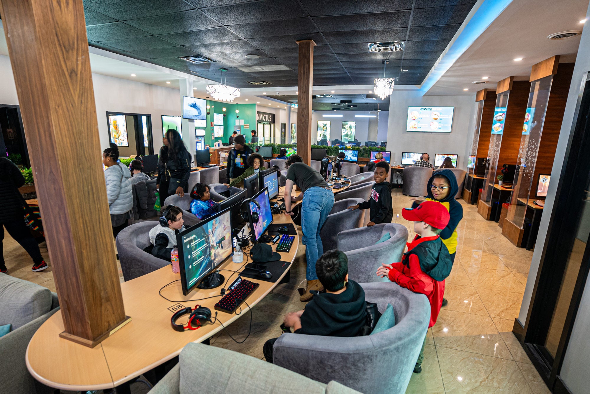 Group enjoying a gaming birthday party at Invictus