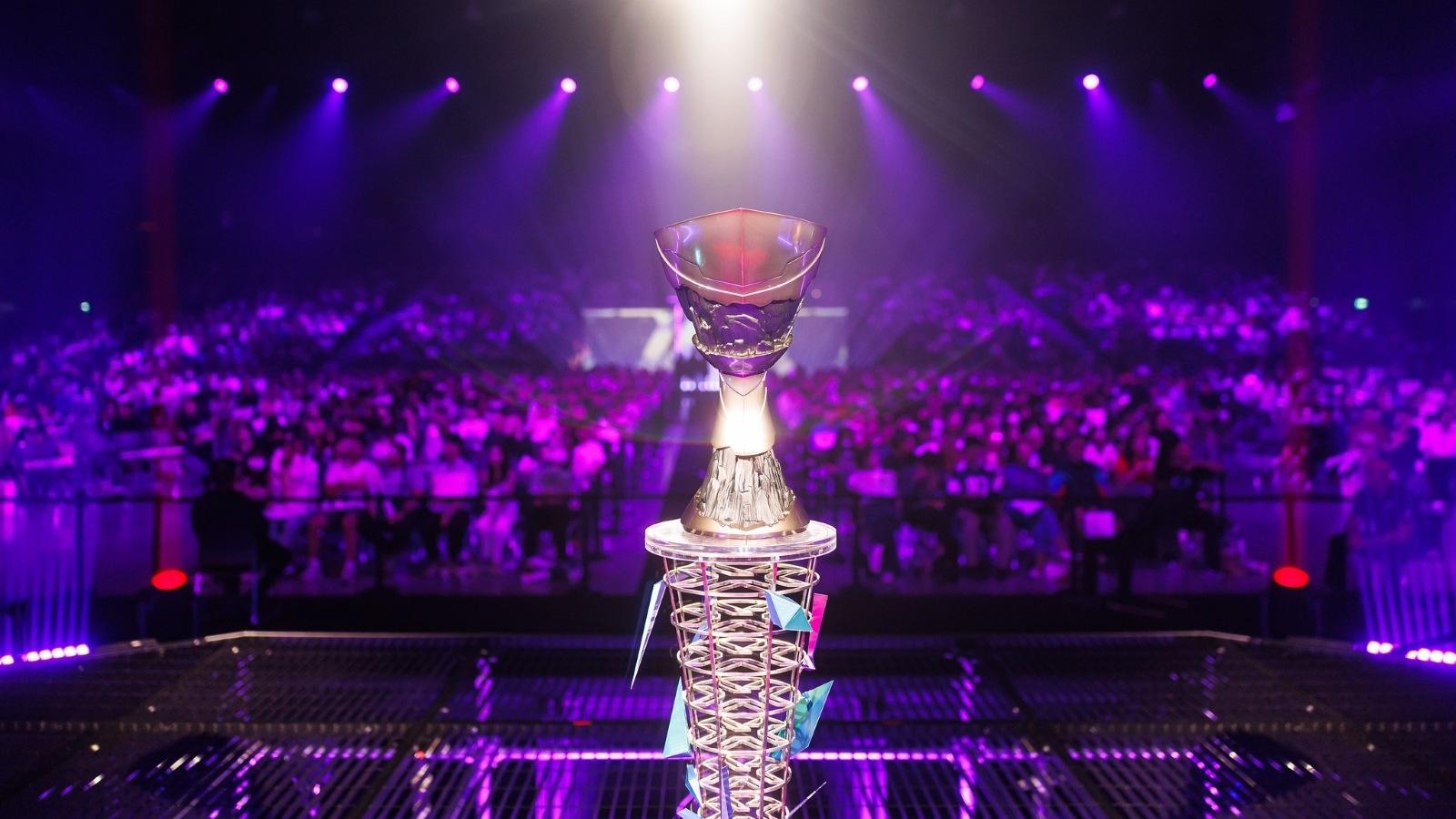 Purple-lit championship arena with trophy and cheering crowd